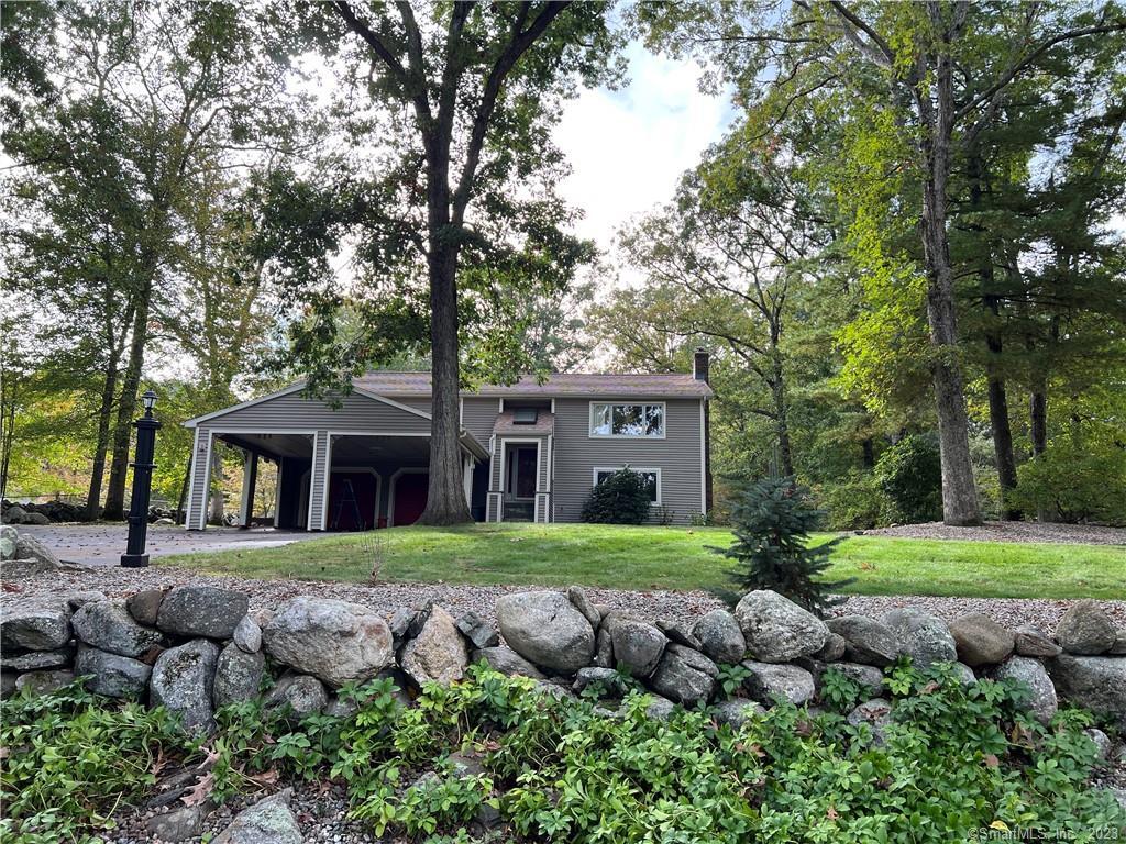 264 Old Colchester Road Hebron, CT 06231 - Photo 1 of 1 a front view of a house with a yard and trees