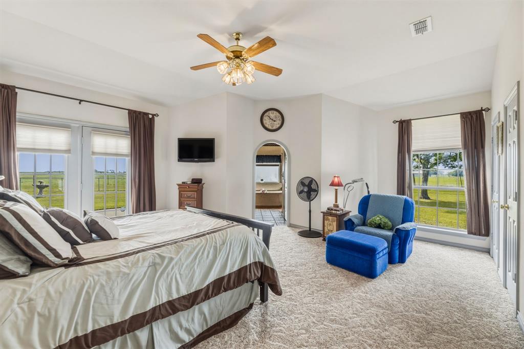130 Blazek Road Alma, TX 75119 - Photo 15 of 34 a bedroom with a bed and chair