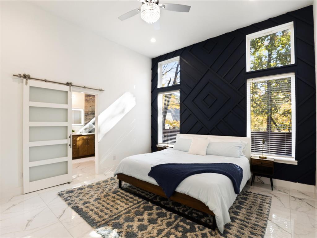 6221 Inca Drive Mabank, TX 75156 - Photo 14 of 35 a bedroom with a large bed and a window