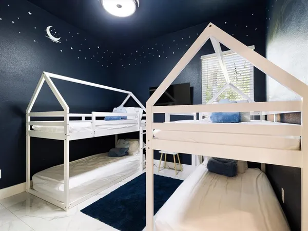 a bathroom with a granite countertop sink a toilet and bathtub