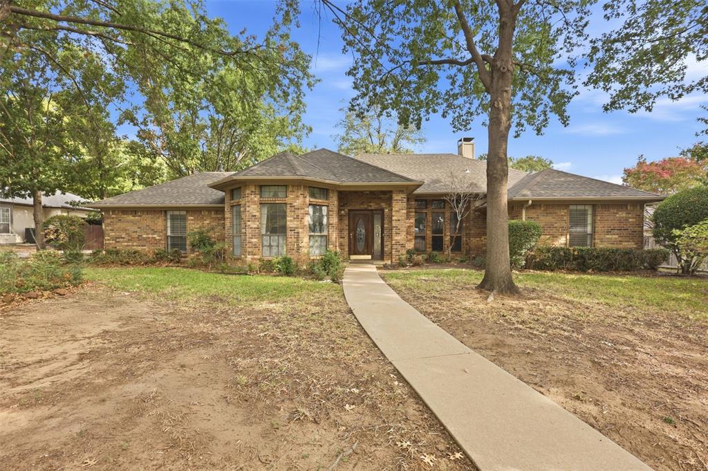 37 Timbergreen Circle Denton, TX 76205 - Photo 1 of 31 Brick exterior with a gabled roof and a prominent bay window