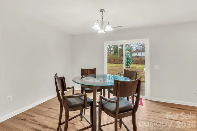 a kitchen with stainless steel appliances granite countertop a stove and cabinets