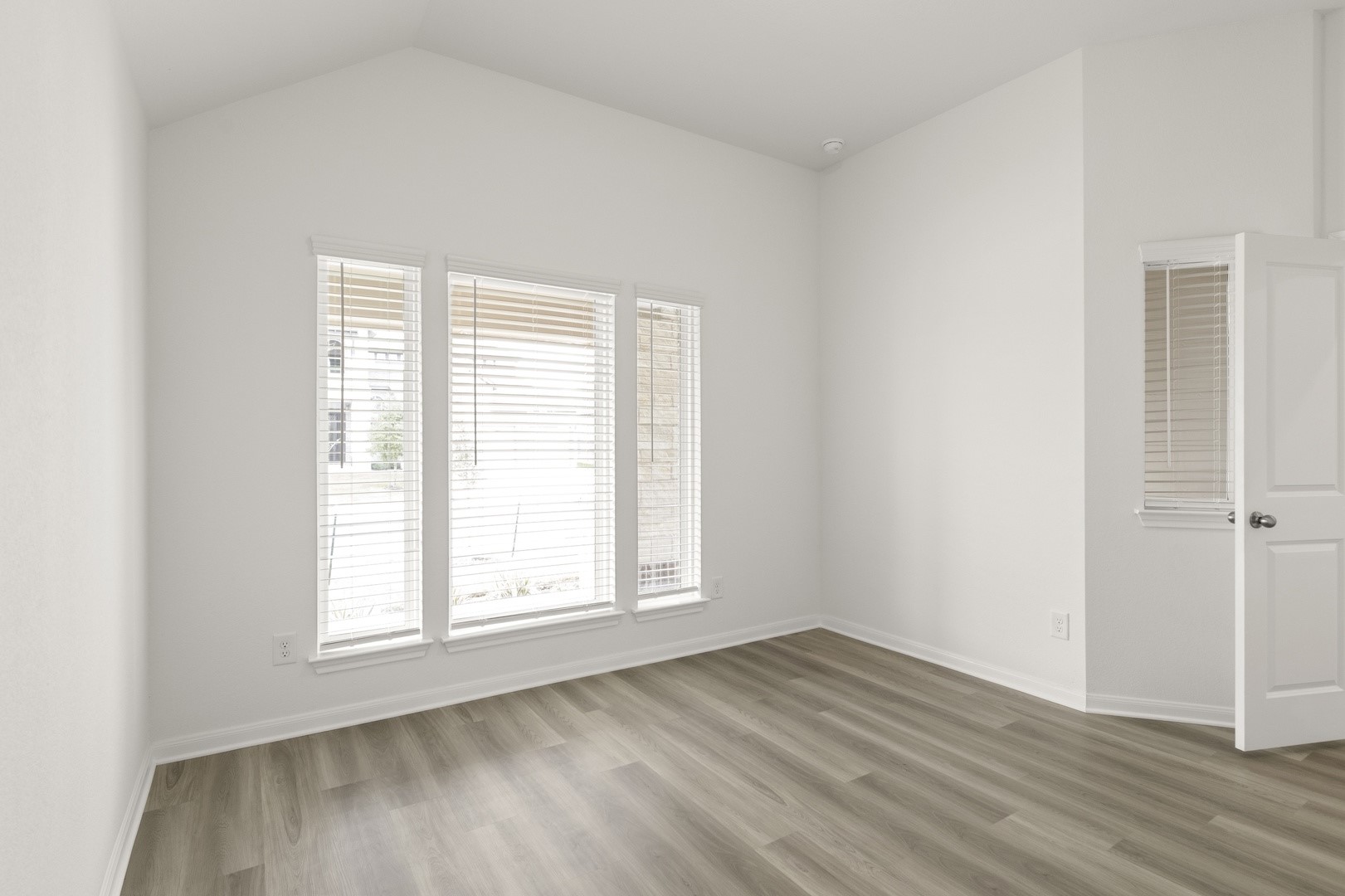 3729 Pin Oak Hills Seguin, TX 78155 - Photo 11 of 22 Empty room featuring light wood finished floors and vaulted ceiling