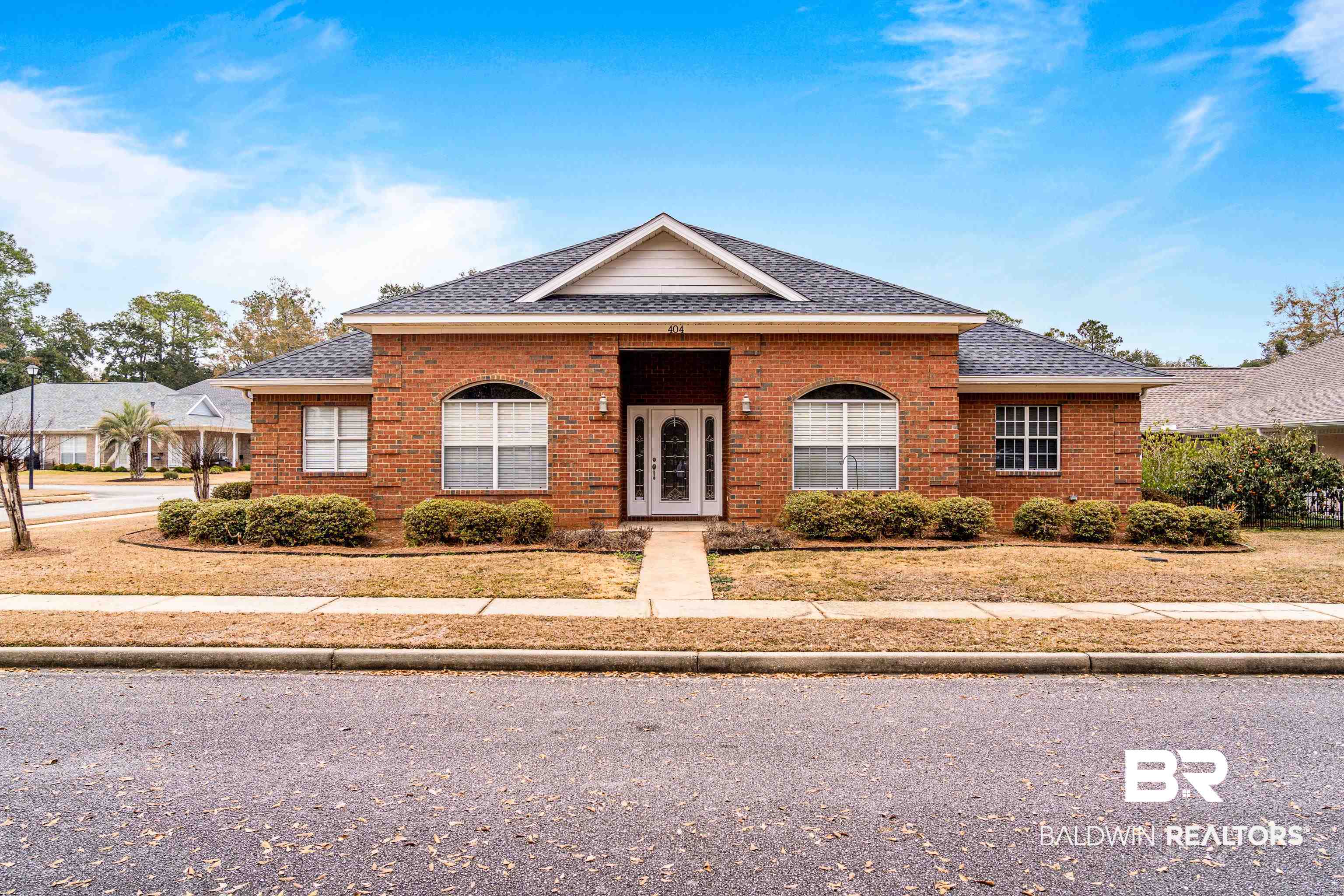 404 Savannah Lane Foley, AL 36535 - Photo 3 of 29 View of front of property featuring brick siding and a shingled roof