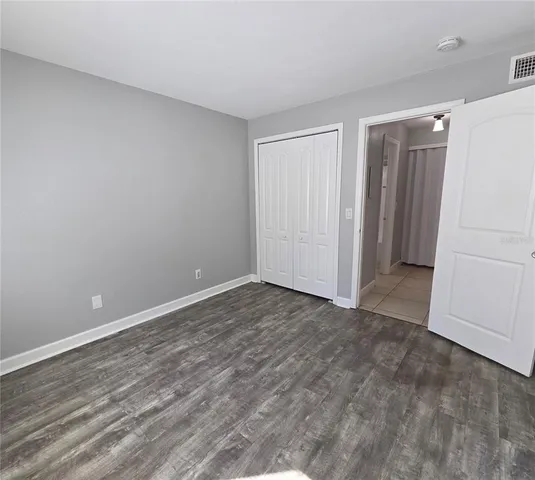 a bathroom with a toilet a sink and a mirror