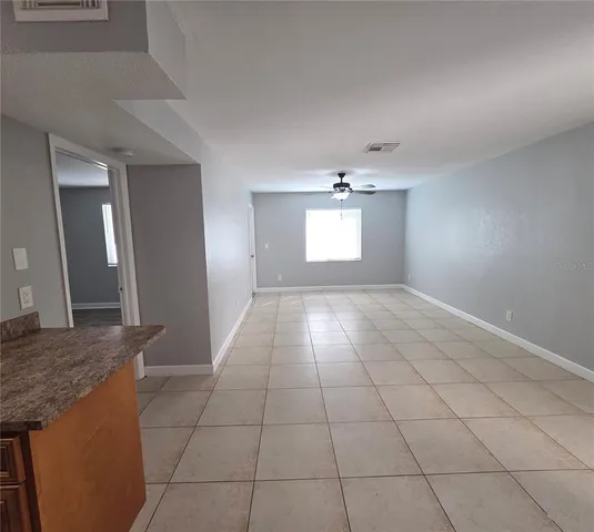 a view of an empty room and window