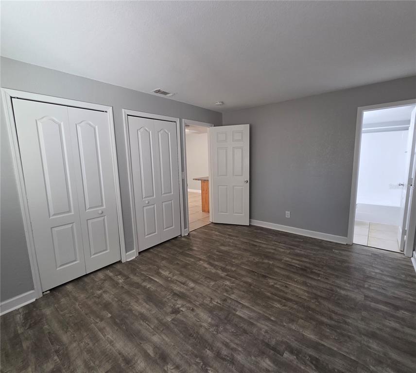 510 Golden Raintree Place, Unit 510 Brandon, FL 33510 - Photo 10 of 18 a view of an empty room with wooden floor