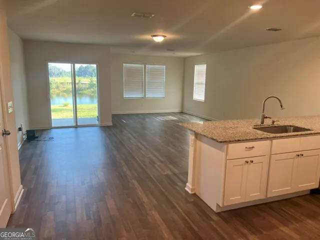 a kitchen with sink and window