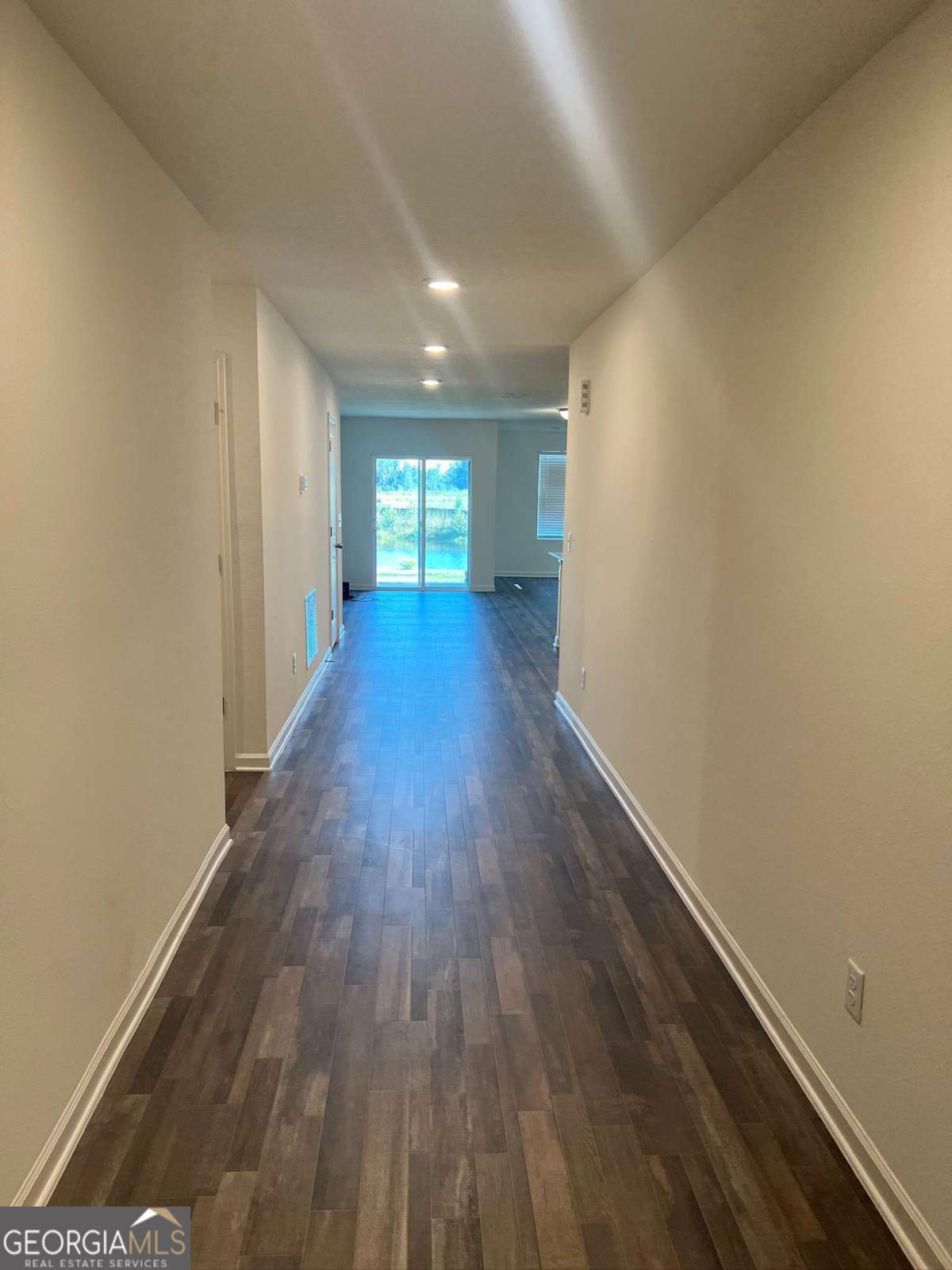 127 Oarsman Crossing St. Marys, GA 31558 - Photo 3 of 17 a view of empty room with wooden floor