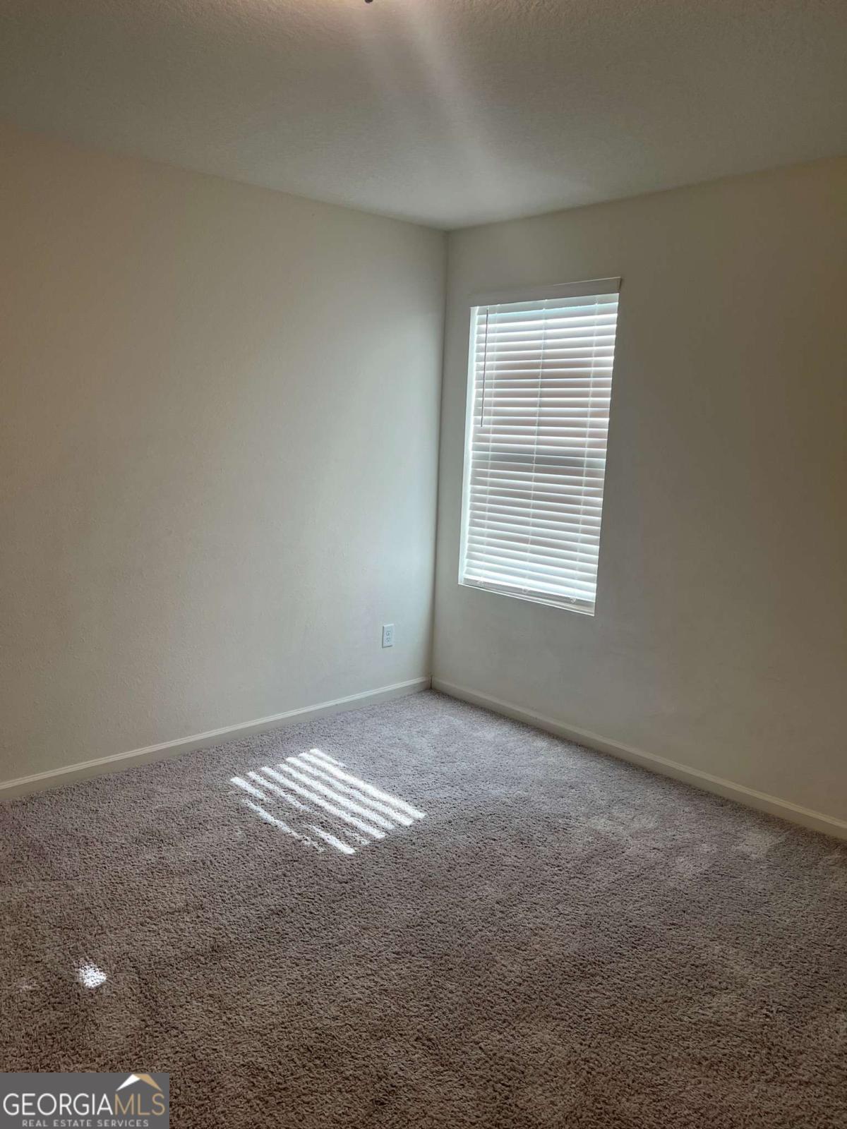 127 Oarsman Crossing St. Marys, GA 31558 - Photo 6 of 17 a view of an empty room with a window