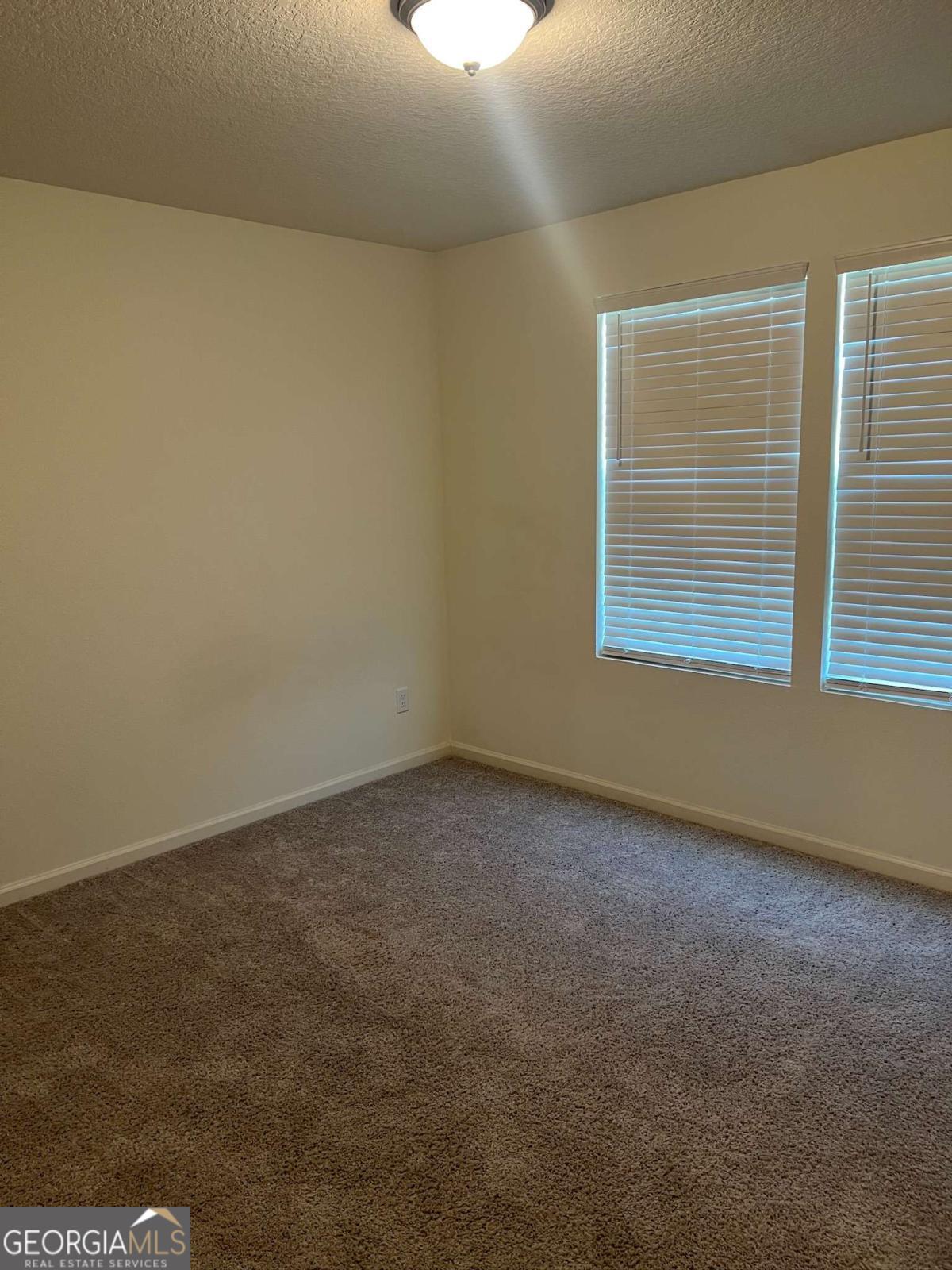 127 Oarsman Crossing St. Marys, GA 31558 - Photo 7 of 17 an empty room with a window
