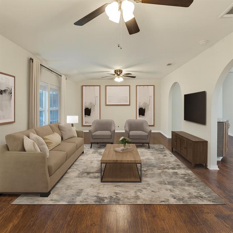 a living room with furniture and a flat screen tv