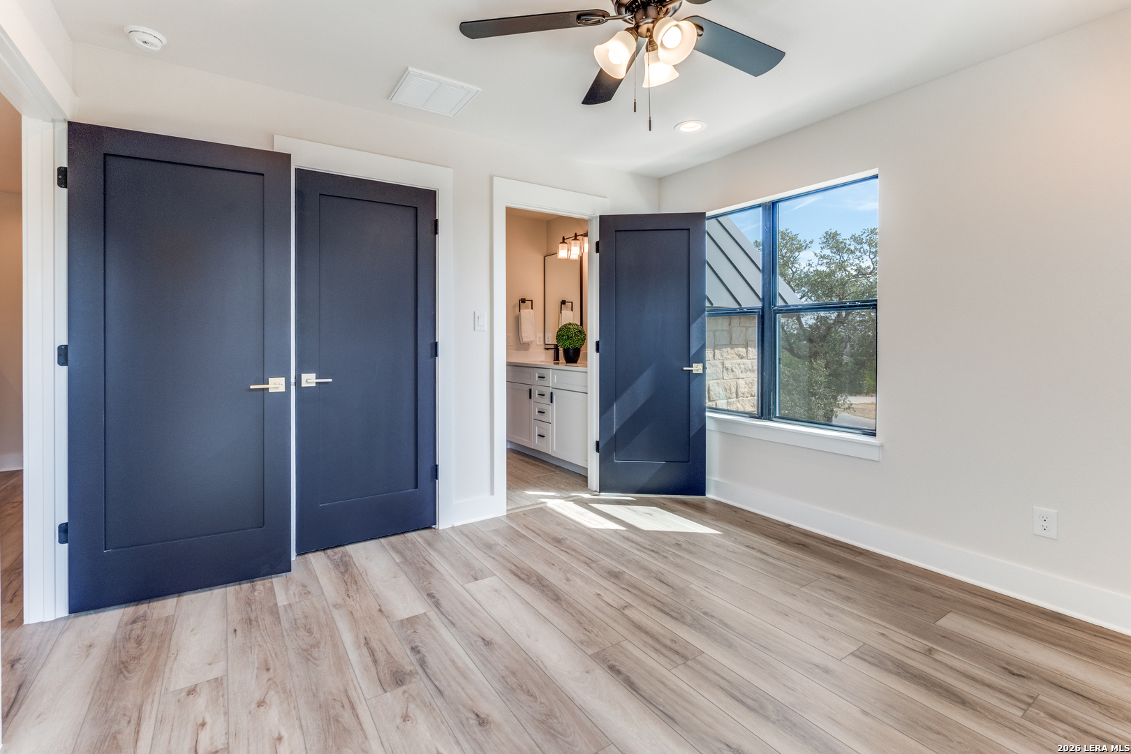 166 Restless Wind Spring Branch, TX 78070 - Photo 23 of 36 a view of a livingroom with a large window and wooden floor