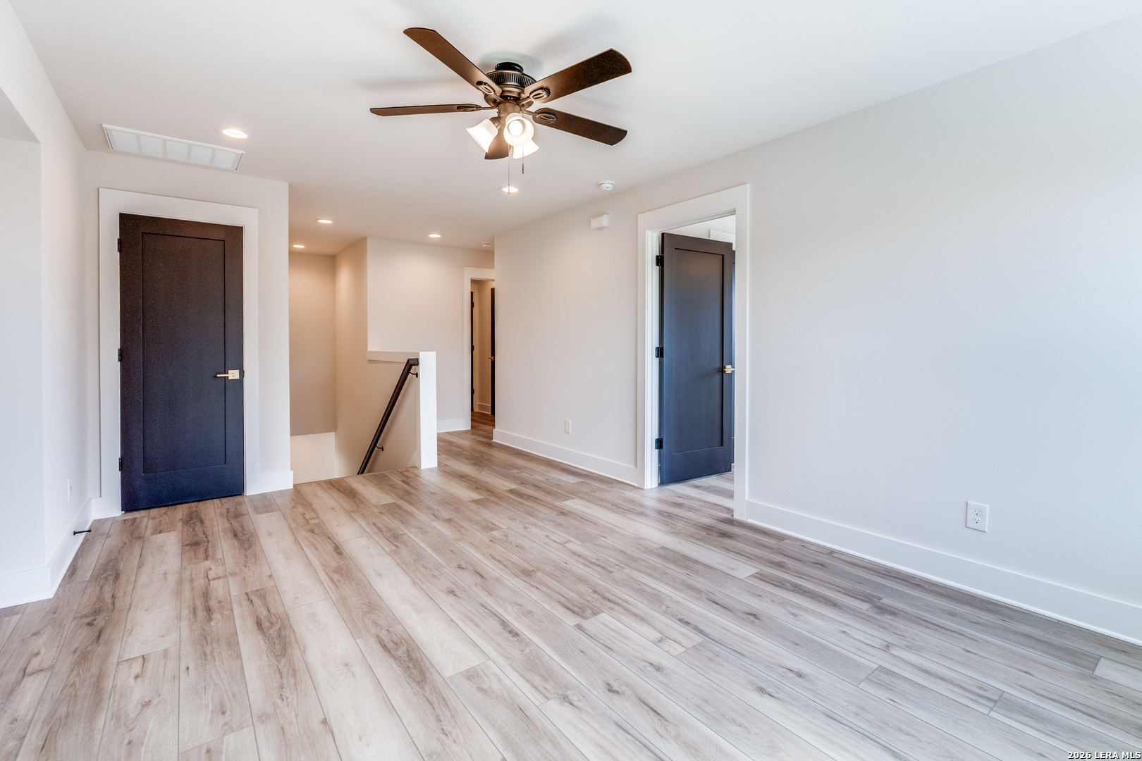166 Restless Wind Spring Branch, TX 78070 - Photo 28 of 36 a view of a big room with wooden floor and a ceiling fan