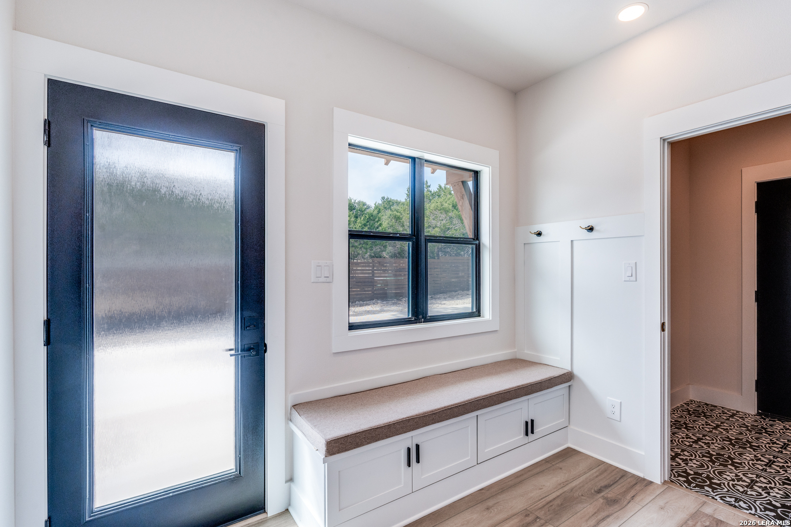 166 Restless Wind Spring Branch, TX 78070 - Photo 31 of 36 a view of an entryway with wooden floor and door