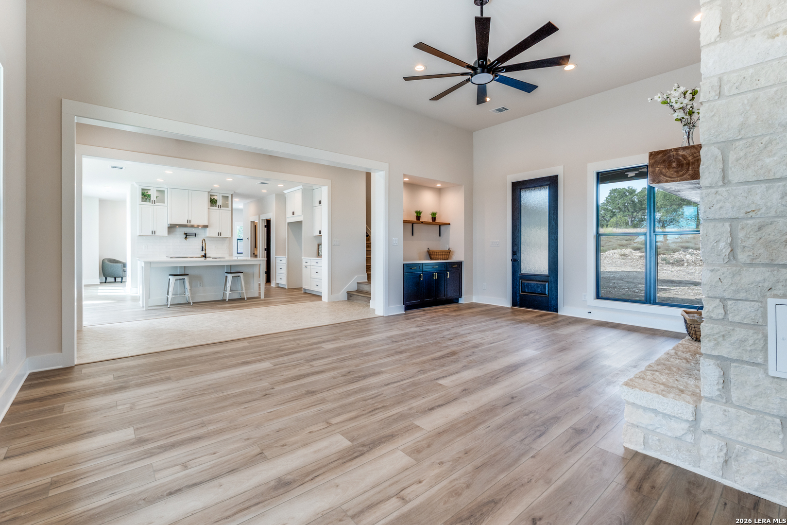 166 Restless Wind Spring Branch, TX 78070 - Photo 7 of 36 a view of a livingroom with a furniture wooden floor and a ceiling fan