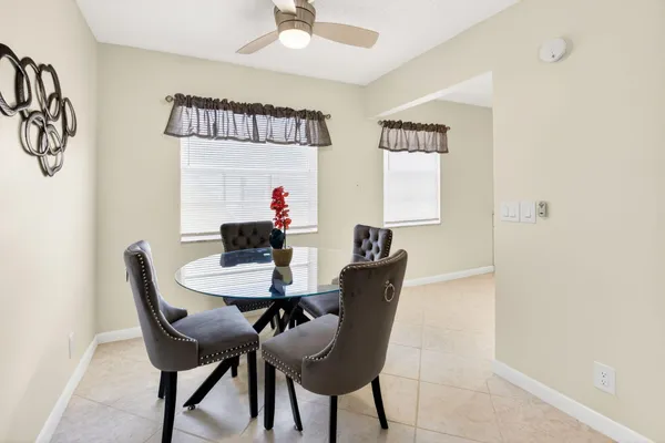 a kitchen with white cabinets appliances and a sink