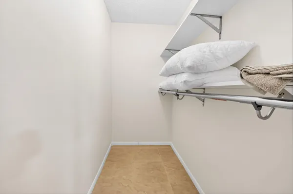 a view of living room with furniture and floor to ceiling window