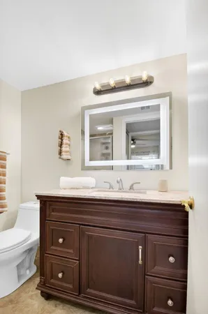 an aerial view of a swimming pool with a yard