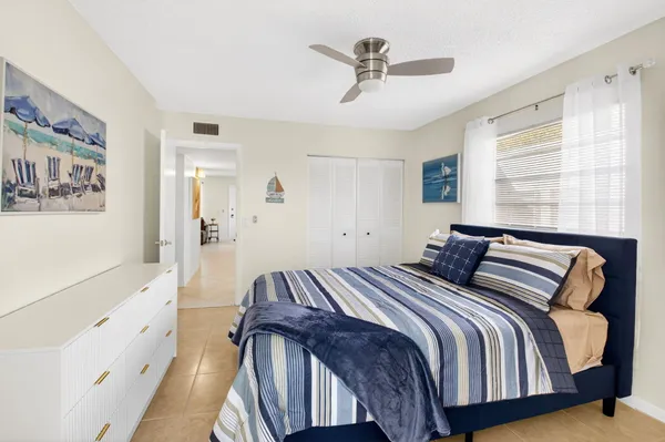 an aerial view of a pool patio chairs and fire pit