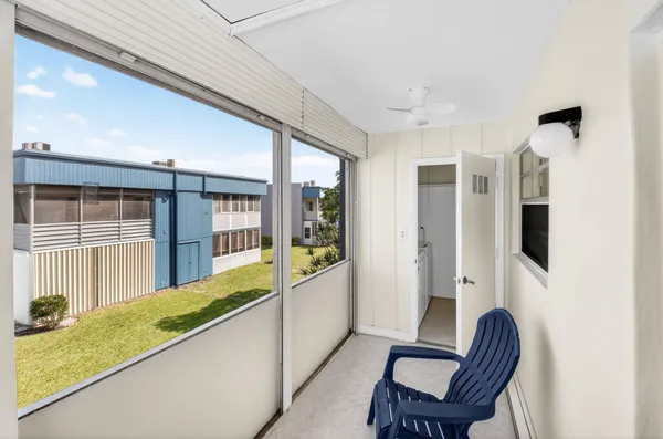 an aerial view of a house with a garden and lake view