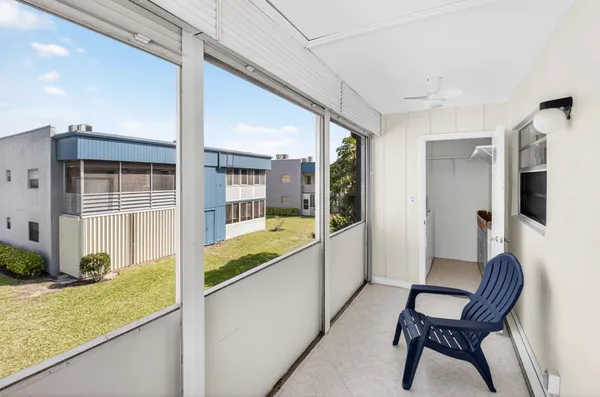 an aerial view of residential house with outdoor space and swimming pool
