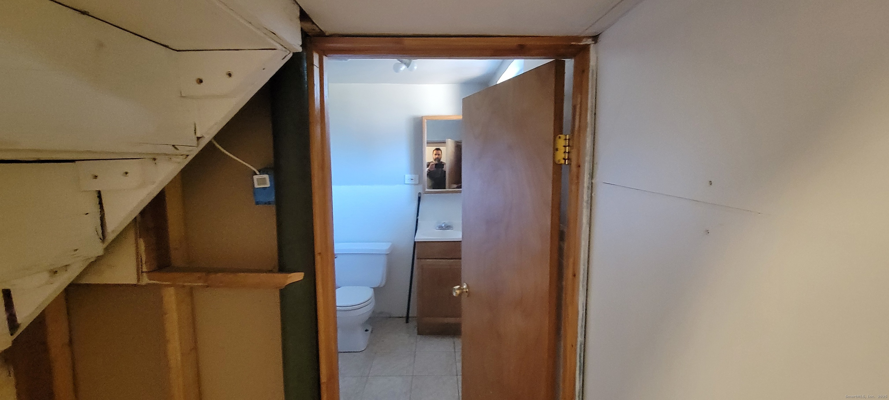 87 Ellington Street Hartford, CT 06106 - Photo 14 of 21 a view of hallway with stairs