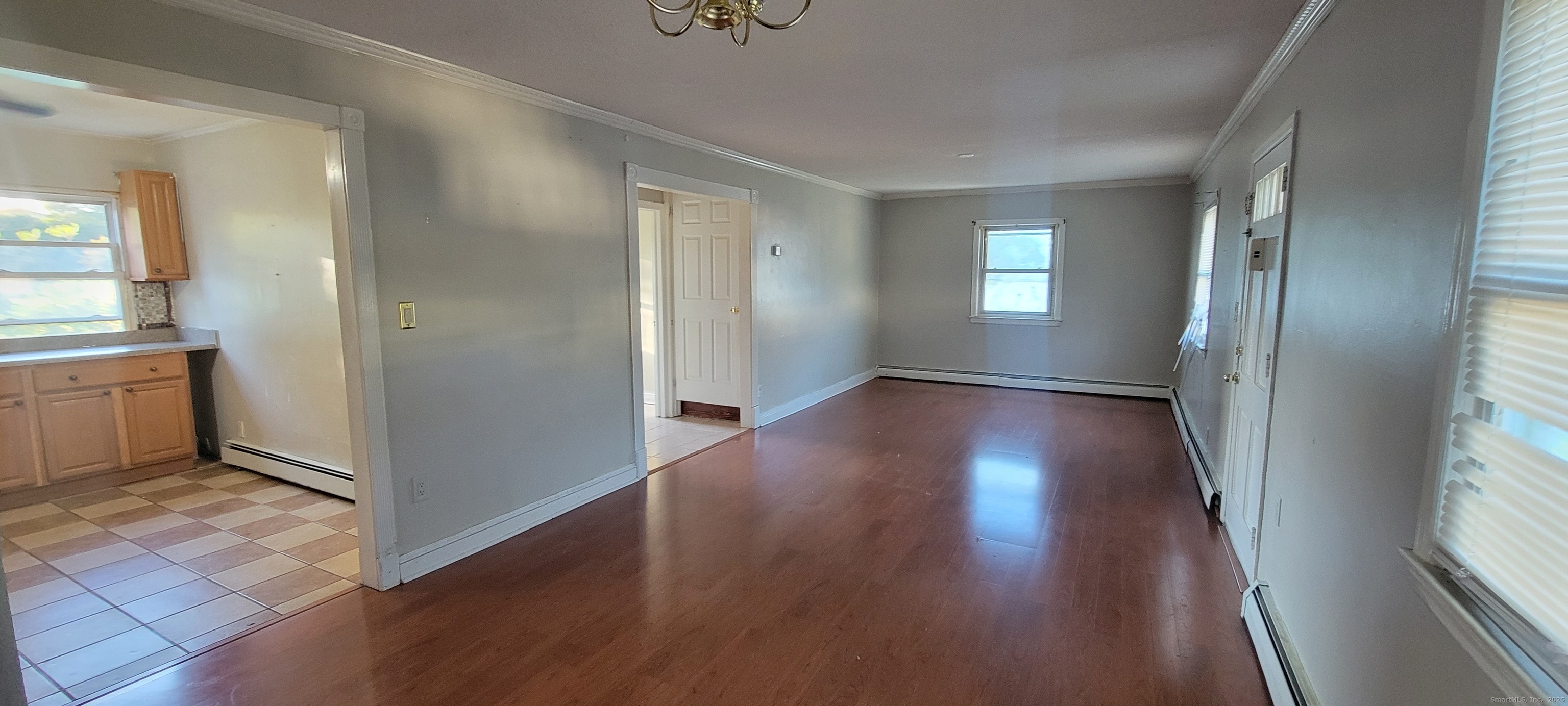 87 Ellington Street Hartford, CT 06106 - Photo 4 of 21 a view of hallway with window and wooden floor