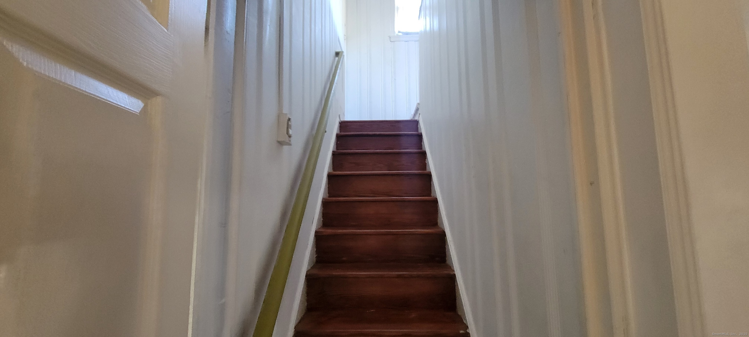 87 Ellington Street Hartford, CT 06106 - Photo 8 of 21 a view of a hallway with wooden floor