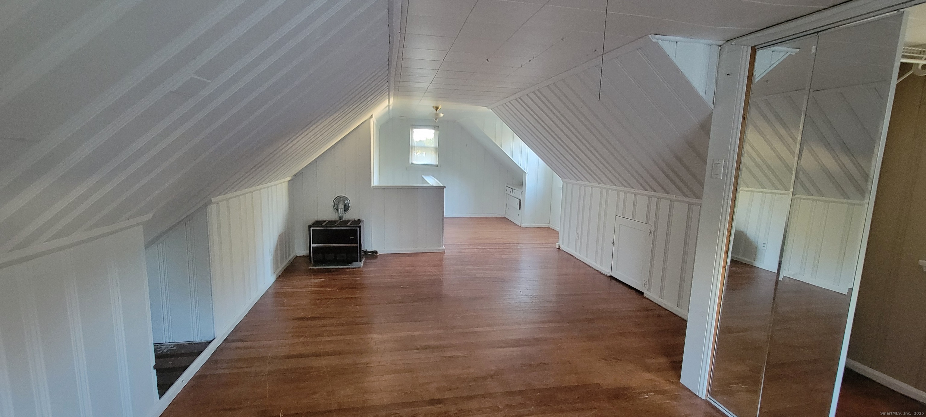 87 Ellington Street Hartford, CT 06106 - Photo 10 of 21 a view of a hallway view with wooden floor and staircase