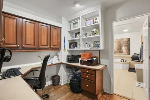 a view of a workspace with furniture