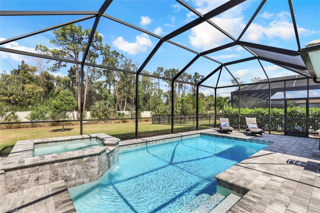 3528 Pilot Circle Naples, FL 34120 - Photo 1 of 46 a view of swimming pool with outdoor seating