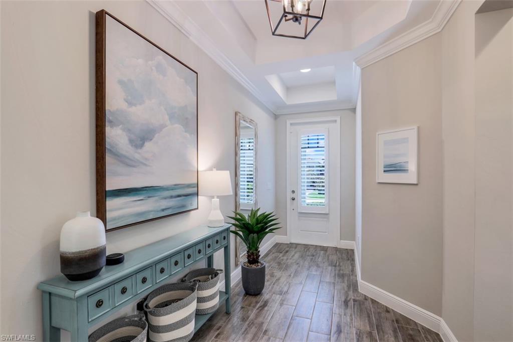 3528 Pilot Circle Naples, FL 34120 - Photo 19 of 46 a view of room with window and wooden floor