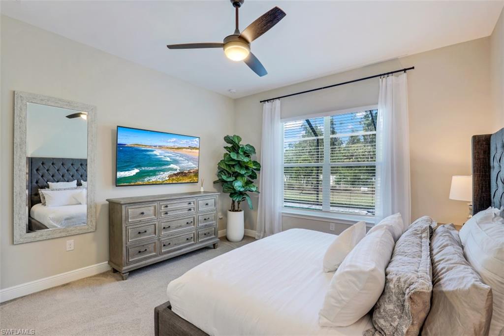 3528 Pilot Circle Naples, FL 34120 - Photo 20 of 46 a bedroom with a bed and a flat screen tv
