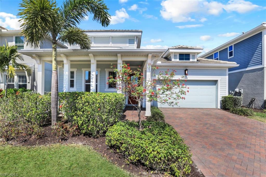 3528 Pilot Circle Naples, FL 34120 - Photo 2 of 46 front view of a house with a yard