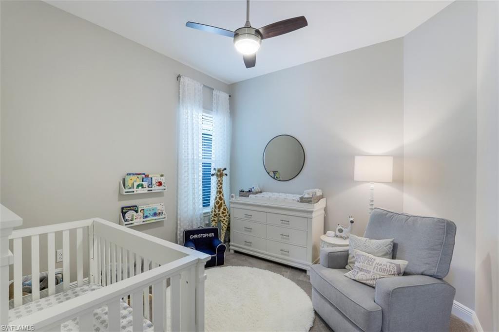 3528 Pilot Circle Naples, FL 34120 - Photo 27 of 46 a living room with furniture and a chandelier