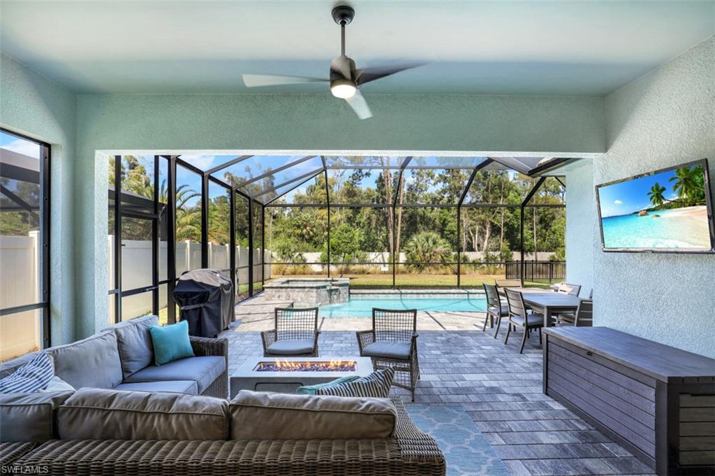 3528 Pilot Circle Naples, FL 34120 - Photo 30 of 46 a living room with furniture and a large window