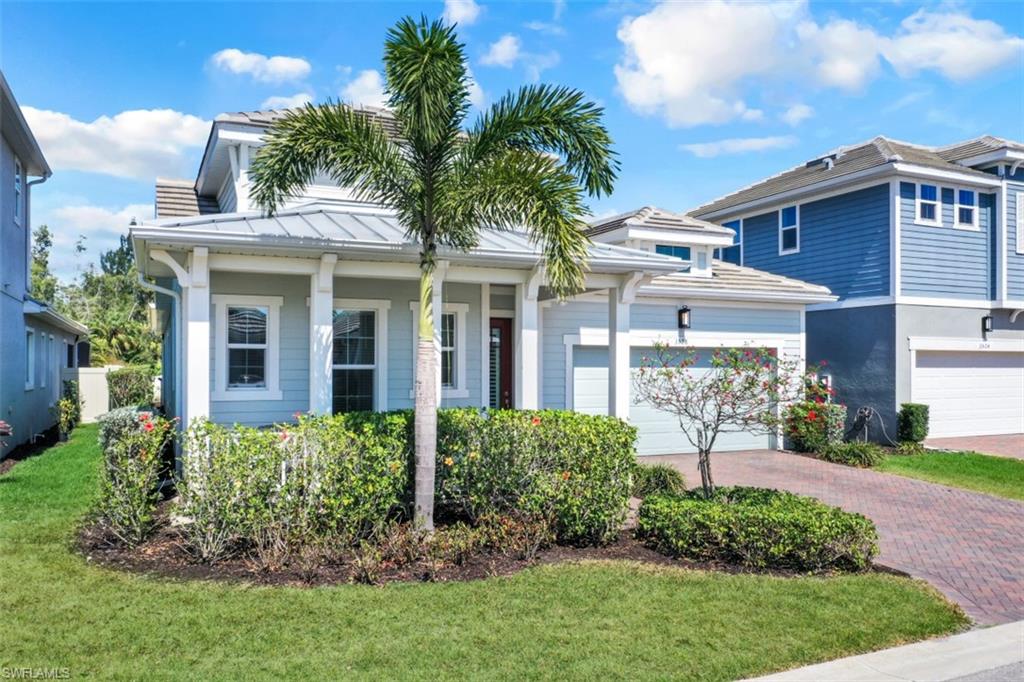 3528 Pilot Circle Naples, FL 34120 - Photo 35 of 46 a view of a house with a yard and potted plants