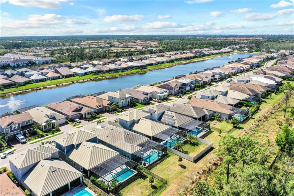 3528 Pilot Circle Naples, FL 34120 - Photo 37 of 46 an aerial view of a city with lots of residential buildings ocean and mountain view in back