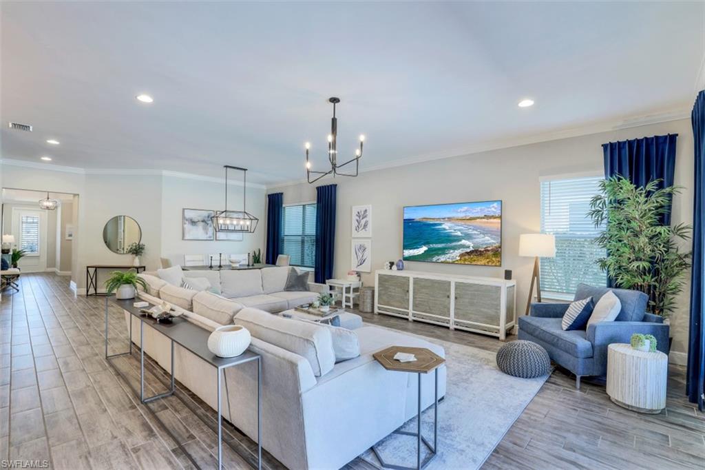 3528 Pilot Circle Naples, FL 34120 - Photo 7 of 46 a living room with furniture and a flat screen tv
