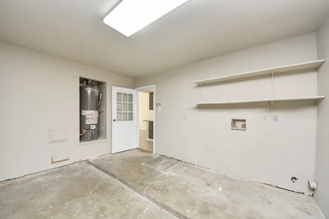 a view of an empty room with a closet