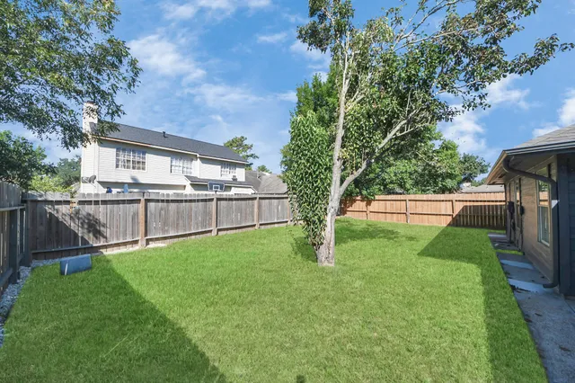 a view of a backyard with a small cabin