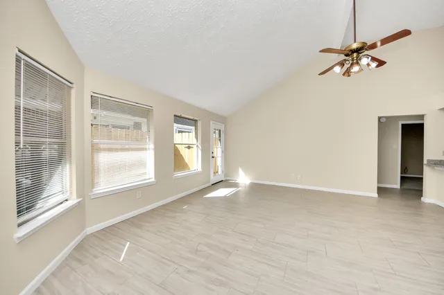 a view of an empty room with a window