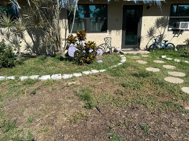 a view of a backyard of the house