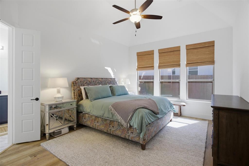 6033 Strada Cove Fort Worth, TX 76123 - Photo 19 of 35 a spacious bedroom with a bed and a window