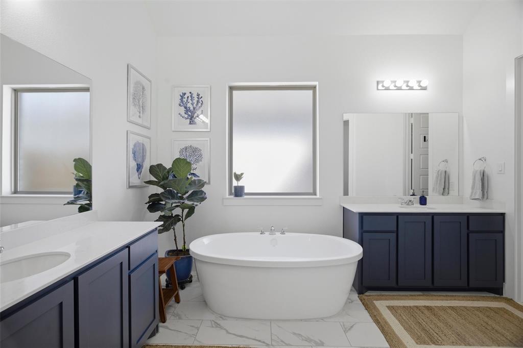 6033 Strada Cove Fort Worth, TX 76123 - Photo 22 of 35 a bathroom with a sink and a mirror