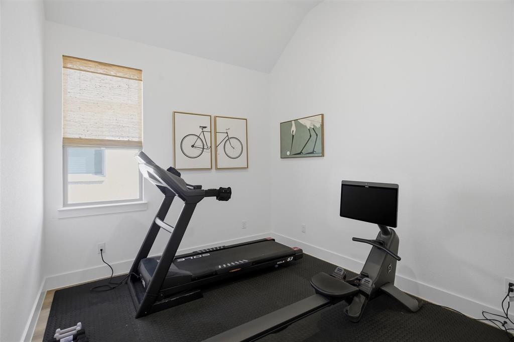6033 Strada Cove Fort Worth, TX 76123 - Photo 26 of 35 a room with gym equipment and windows