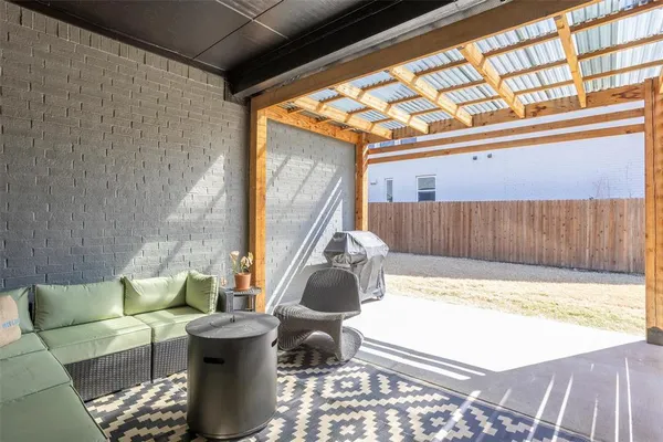 a view of a couches and table in the patio