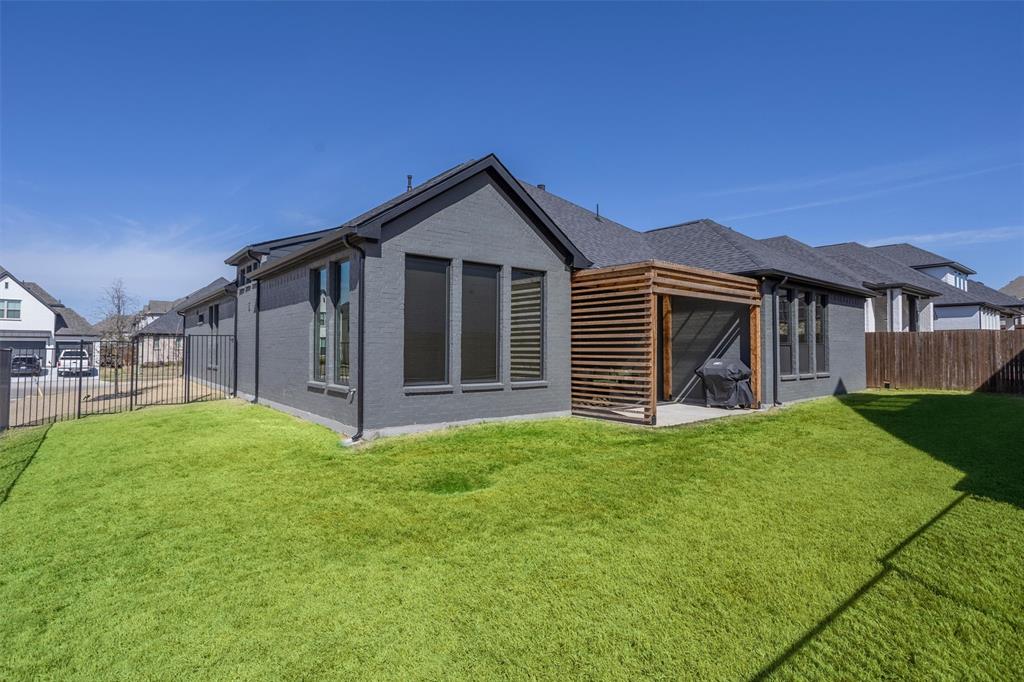 6033 Strada Cove Fort Worth, TX 76123 - Photo 34 of 35 a view of a house with a yard and pathway