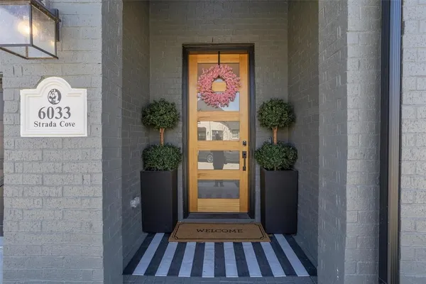 a view of a hallway view with wooden floor and staircase